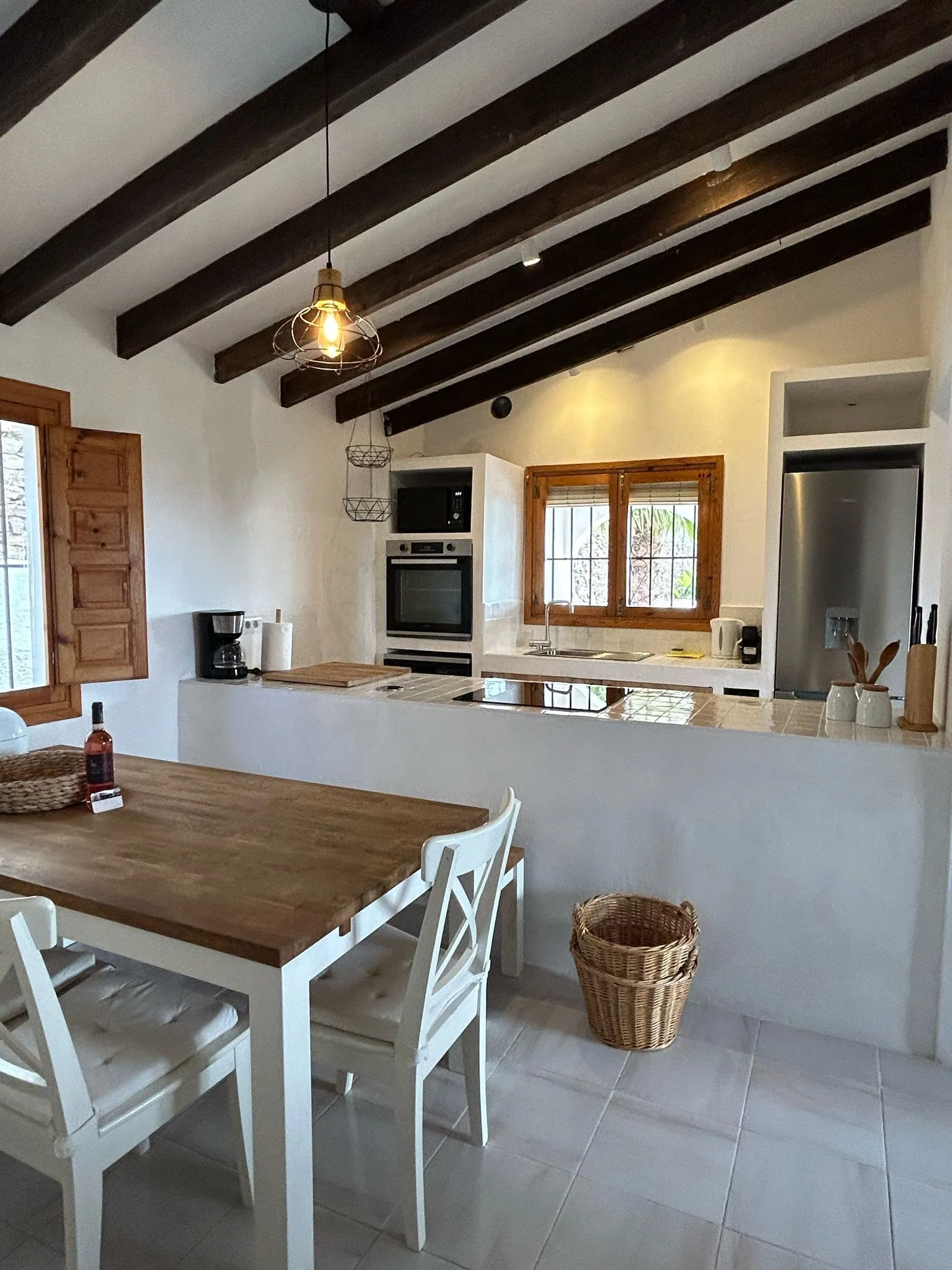 Dining table beside the open kitchen