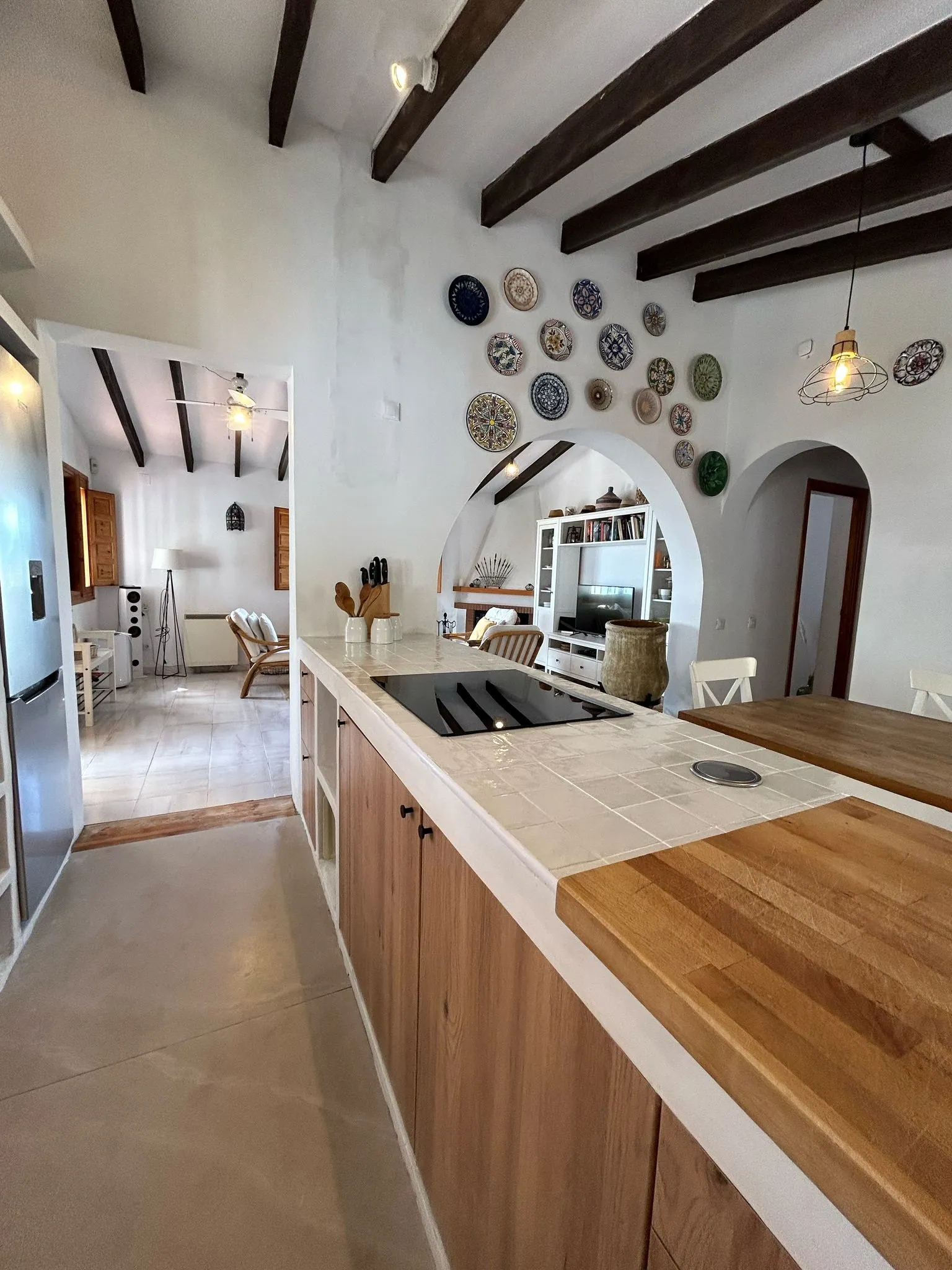 Open kitchen with an archway to the living room