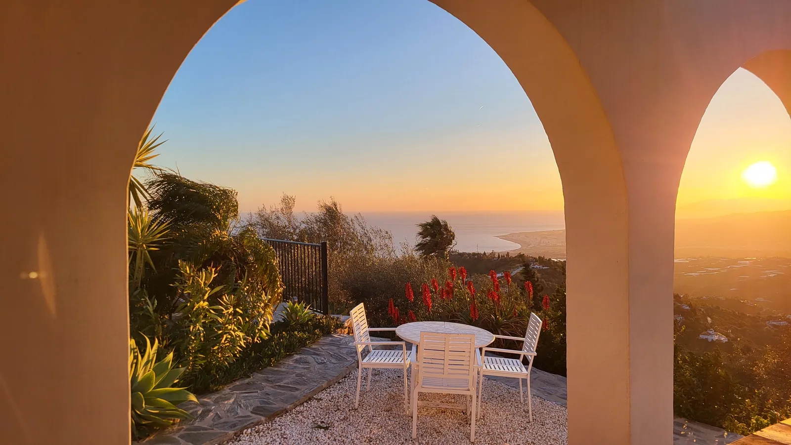 Sunset framed by the terrace arches