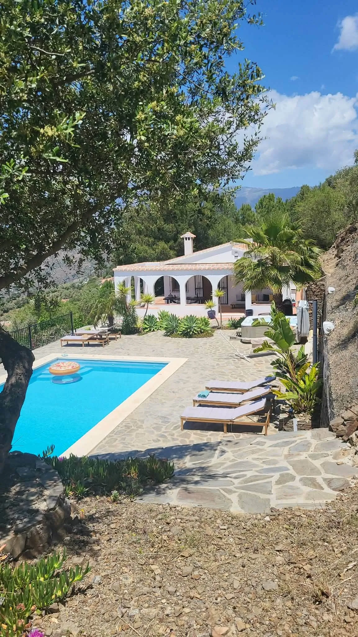 The villa and pool seen from the garden