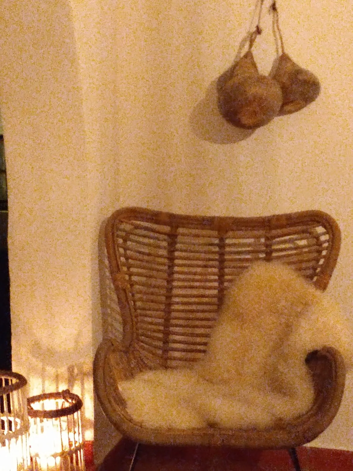 Wicker chair and woven wall baskets